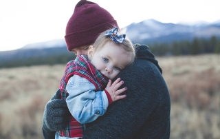 Father cuddling his daughter